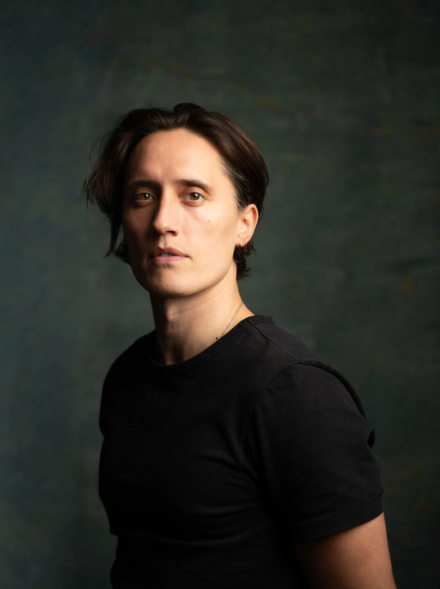 Menswear portrait with moody London studio light