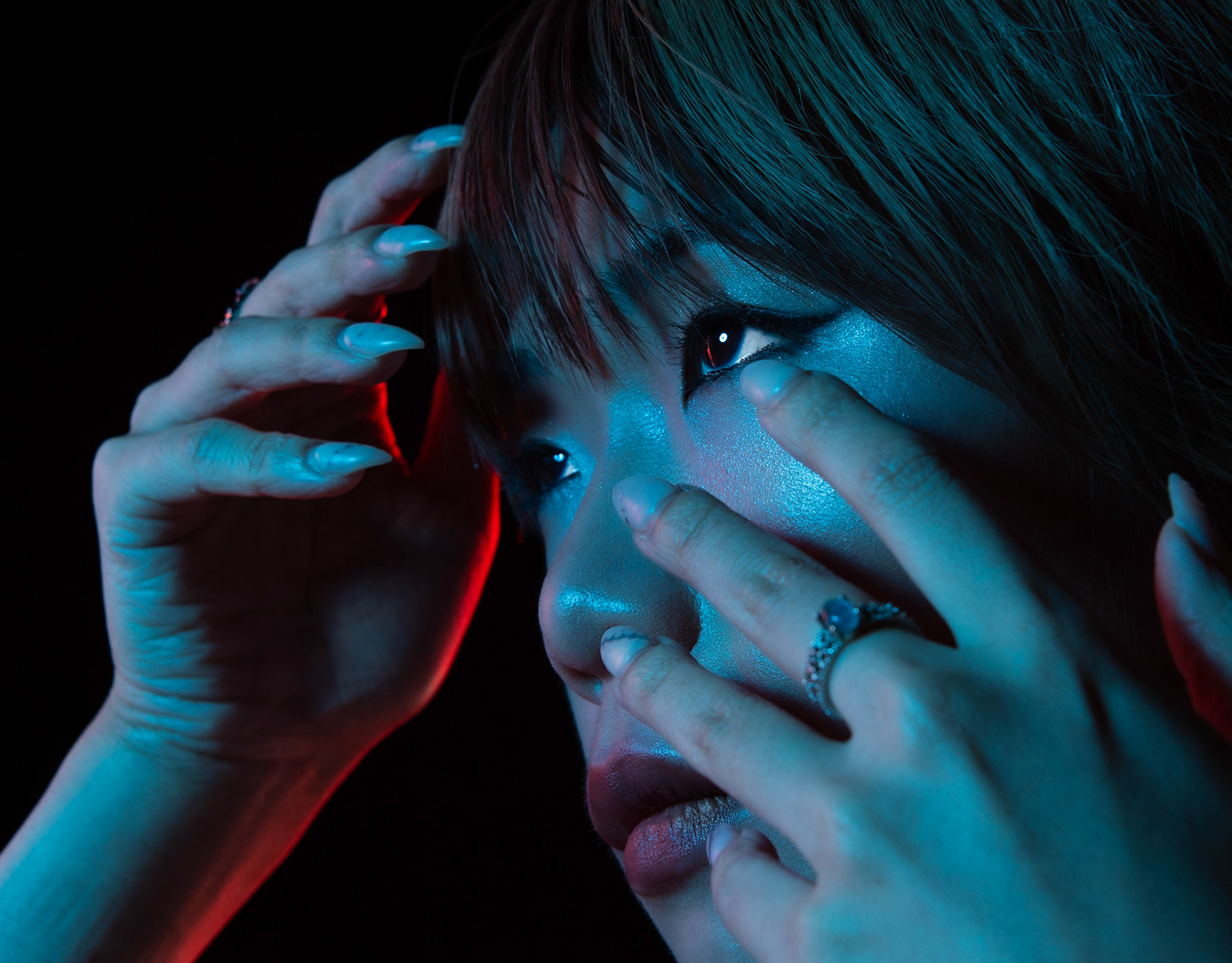 Cinematic London fashion portrait with blue and red studio lighting